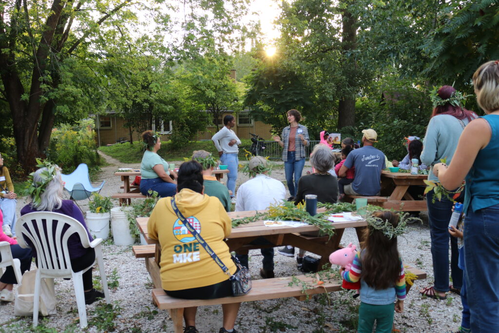 Co-Executive Directors, Mandi McAlister and Taylore McBride, share announcements with community members at Turtle Park at our Fair Future Meetup